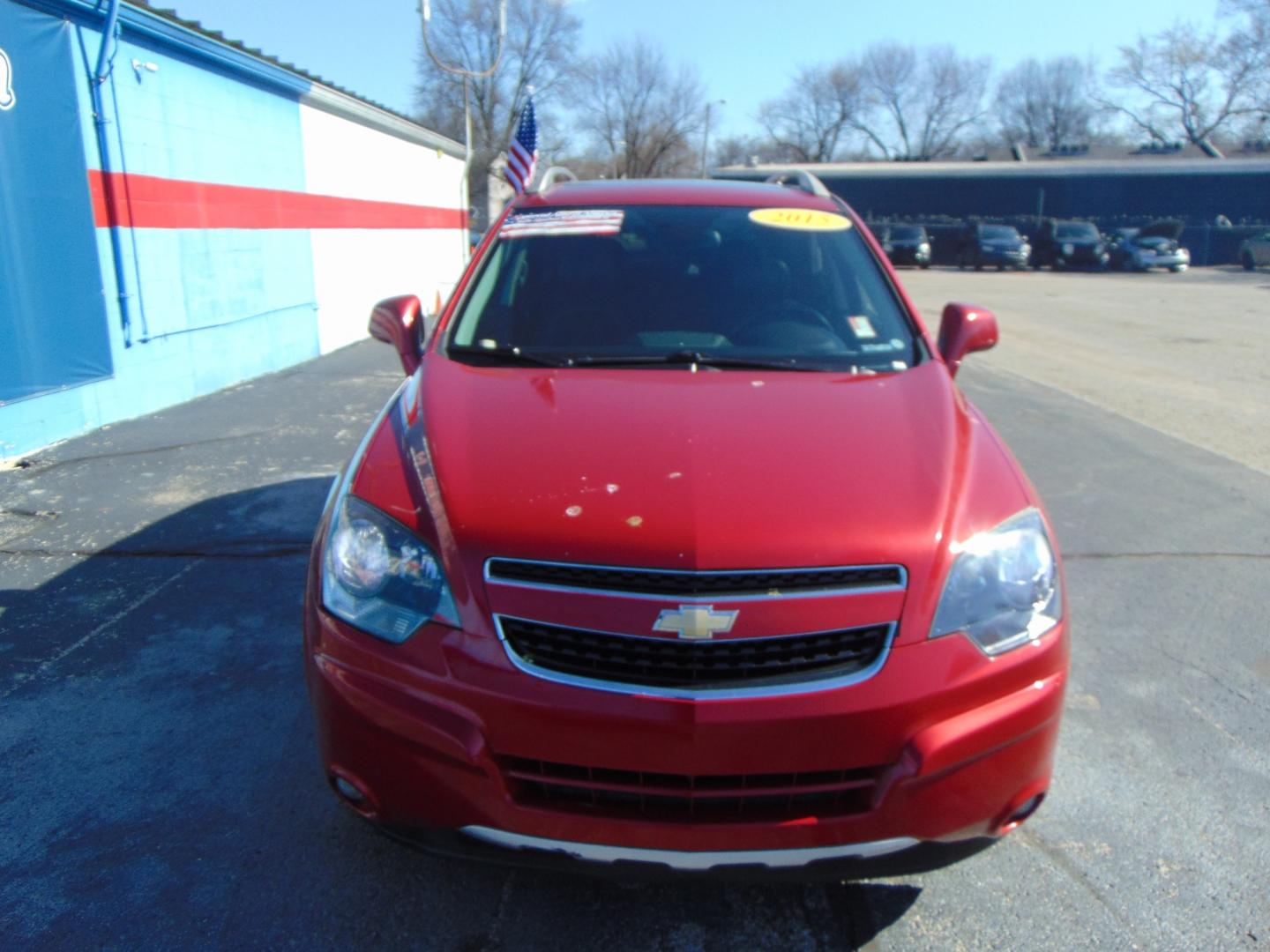 2015 Red Chevrolet Captiva Sport (3GNAL3EK6FS) with an 4-Cyl Flex Fuel 2.4 Liter engine, Automatic, 6-Spd transmission, located at 2105 Dixie Hwy, Louisville, KY, 40210, (502) 772-3333, 38.220932, -85.795441 - Photo#3